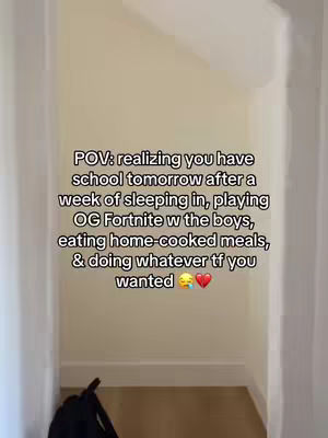 A medium shot of a hallway leading away from the viewer. The walls are beige, with white trim defining the baseboard and ceiling. The perspective includes open doorways on either side. Text overlayed on the image in a white font.