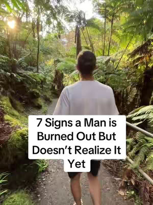 A man walking on a path through a lush green forest, with text overlayed on the bottom.