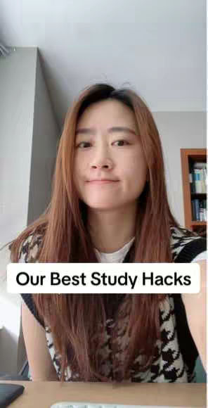 A woman is centered in a vertical frame. She is smiling slightly, looking directly at the viewer. She has long brown hair and is wearing a sleeveless black and white patterned top over a white shirt. Behind her, a light-colored wall and the upper part of a bookshelf with visible books are visible. A white rectangular text overlay at the bottom says "Our Best Study Hacks".