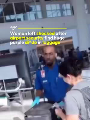 The cover image shows a scene at an airport security checkpoint. A TSA agent in a blue uniform is looking at a suitcase. A woman in a grey shirt and a face mask stands in front of a TSA agent, looking down at the suitcase. Above the people is a title in yellow with the text "Woman left shocked after airport security find huge purple di*do in luggage"