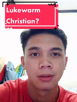 A young man with dark hair and a red shirt is centered in the frame. A red rectangular overlay box with white text that asks \"Lukewarm Christian?\" is above his head.