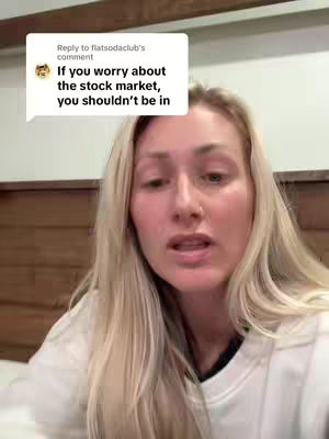 A woman with blonde hair is shown in a close-up shot, looking directly at the camera. A text bubble appears in the upper-left corner of the frame.