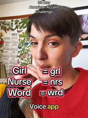 A woman with short dark hair and a red sweater looks towards the camera. Text overlays on screen show American accent pronunciation of words. The background showcases a wall and a calendar.