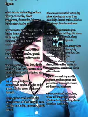 A selfie-style image featuring a person holding a phone partially covering their face, displaying text about different zodiac signs. The text includes descriptions associated with each sign listed in a vertical format, with the person wearing a blue top and the environment blurred.