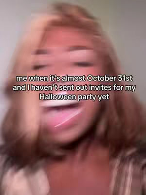 The image is a blurred, close-up of a person's face, likely a woman, with light-colored hair. She's positioned at the center, her expression somewhat exaggerated, as her mouth appears open. Overlaid text is visible, hinting at the theme of a Halloween party, and the overall style suggests a casual, social media post.