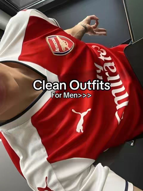 The cover image shows a person wearing a red and white soccer jersey, with a partial view of the person's arm and chest. The jersey has the Arsenal emblem and the word \"Emirates\" visible. The focus is on the jersey, with the person's face mostly out of frame.