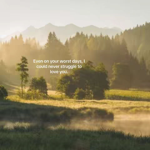 A scenic landscape depicts a serene natural environment at dawn or dusk. The scene captures a valley embraced by layers of rolling hills and mountains veiled in a soft, misty haze. In the foreground, a calm body of water adds to the tranquil atmosphere, with sunlight casting a warm glow across the scene, enhancing the dreamy quality of the landscape.