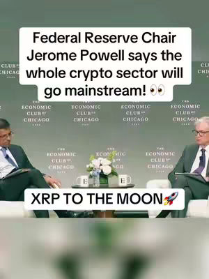 The image is a vertical video frame showing a panel discussion with two men in suits seated on a cream-colored couch. Behind them, the backdrop features repeated logos for 'The Economic Club of Chicago.' A white text overlay at the bottom reads 'XRP TO THE MOON' with a rocket emoji. Above this is a white text box with the text: 'Federal Reserve Chair Jerome Powell says the whole crypto sector will go mainstream!'.