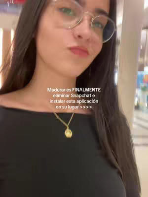 The cover image features a young woman wearing glasses with text overlayed. She is facing slightly towards the camera with the background showing indoor lighting. She has dark hair and is wearing a black top with a gold necklace.