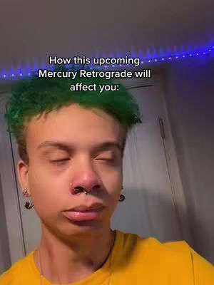 A person with green-dyed hair and facial piercings looks down with closed eyes. Text in the upper portion of the frame announces that the upcoming Mercury retrograde will affect the viewer.