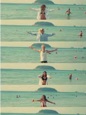 The cover image is a composite of five horizontal strips, showing different women standing in a body of water with their arms outstretched as if embracing the scene. The water is a light teal color, suggesting a tropical location, and the sky is a muted, slightly desaturated blue. Elements of the background include distant landmasses and other individuals in the water. The women in each strip of the image appear to be standing in water, with their bodies partially submerged. They are facing the same direction and they all have their arms outstretched in a gesture of joy. Each woman is wearing a different combination of clothing. The overall composition is peaceful and celebratory, evoking a sense of freedom and togetherness.