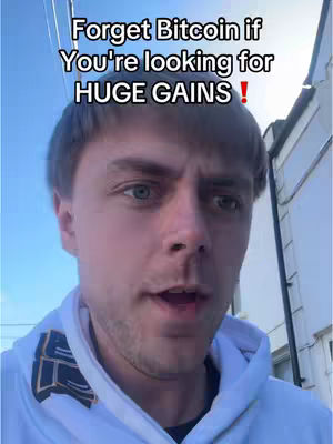 The cover image features a young man in a hoodie, looking directly at the camera with an open mouth, set against a backdrop of a building and blue sky. Text overlayed across the top says, 'Forget Bitcoin if You're looking for HUGE GAINS!'.