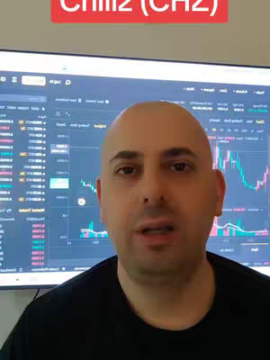 A man with a shaved head in a black shirt is centered in front of a computer monitor showing a trading platform interface. A red rectangular overlay with white text is at the top of the image.