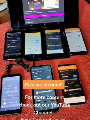 Image shows multiple smartphones and a tablet laid out on a red surface, presumably a bed. The phones display the CryptoTab browser, highlighting Bitcoin mining. A text overlay reads 'Passive Income!!' in an orange box. The composition is centered on the phones; the image has a tech and finance theme.