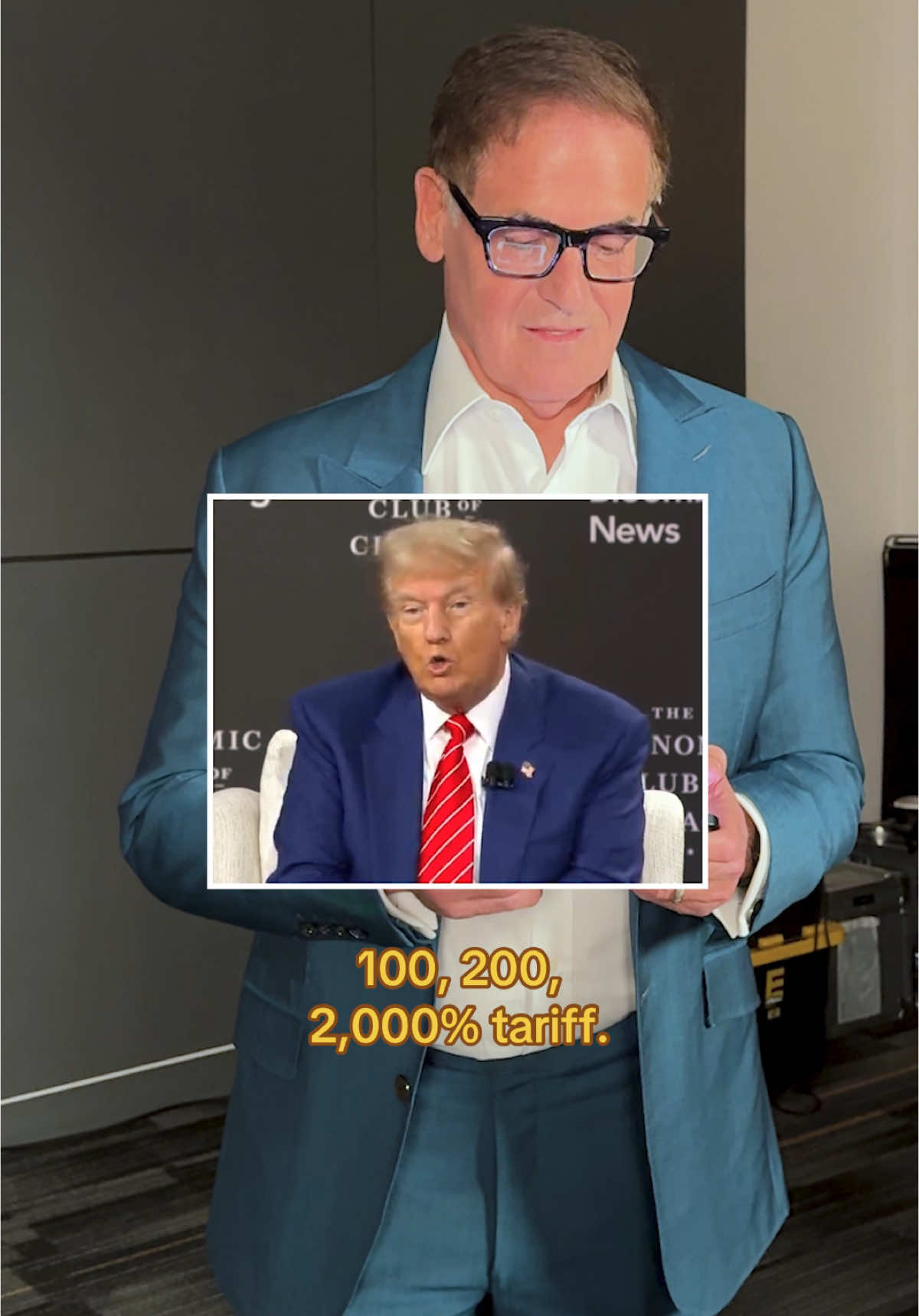 Mark Cuban holding a screen that shows Trump speaking at an event. Text overlay at the bottom reads "100, 200, 2,000% tariff."