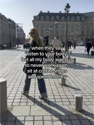 A woman with blonde hair and sunglasses walks on a cobblestone street in front of a large building. Text overlays the image.
