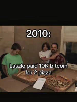 The image shows a family scene with a brown-haired man with a beard embracing a child. The image features three people beside two pizzas in boxes. The text overlay shows the value of Bitcoin in 2010 and now.
