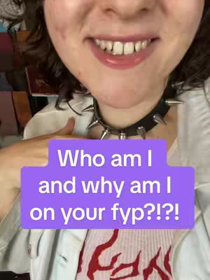 The cover image is a selfie featuring tightly framed shot of a person's face, with the focus on their mouth and a small portion of their chin. The person is smiling, and their teeth are visible. They are wearing a black studded choker and a white shirt. The background is blurred, but hints of a colorful environment are visible. A purple box overlay with white text at the bottom is superimposed.