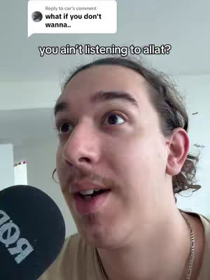 The cover image features a young man in a close-up shot, with a microphone partially visible in the foreground. He appears to be speaking or reacting to something with an open mouth and engaged expression. The background is a light-colored wall and ceiling, providing a clean setting. A comment bubble with text is at the top-left of the image.