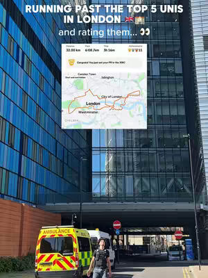 The cover image shows a tall, modern building complex with large glass windows and a light blue and white facade. In the foreground, a yellow ambulance with red and yellow markings is parked, and a person is walking down the street beside it. Overlayed on the image is a map and some information about the run. The sky is bright, indicating a sunny day.