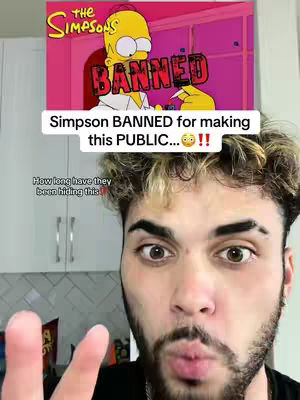 The cover image features a man with an eye-catching appearance gazing intently at the camera. Behind him, a portion of a white cabinet and a display related to The Simpsons. The overlay features a "BANNED" graphic. The layout is a selfie-style composition.