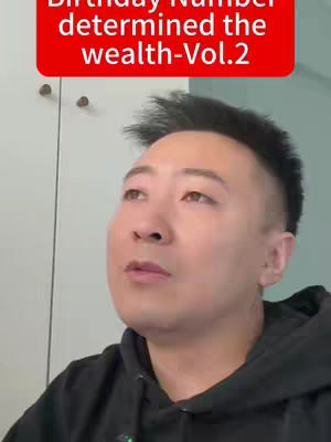 A man looks upwards with a somewhat curious expression, set against a background of a white or light-colored wall or surface. Above the man's head is a red banner with white text.