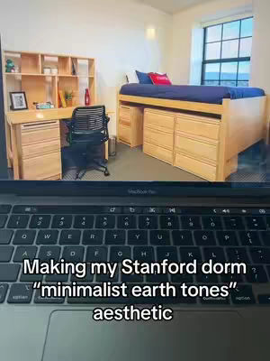 A laptop keyboard at the bottom, showing a room that is a minimalist college dorm.