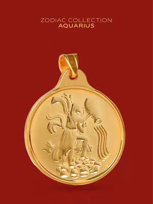 A close-up shot of a gold pendant featuring an Aquarius symbol. The pendant is circular and has a detailed relief of the water bearer. The background is a solid, deep red color. The text 'ZODIAC COLLECTION AQUARIUS' is at the top.