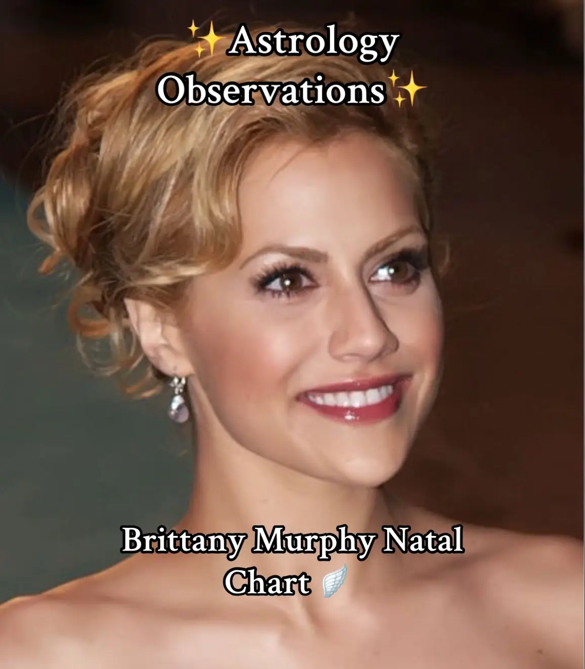 A close-up shot of a woman smiling, with text overlays. The woman has blonde hair styled in an updo, and is wearing light makeup with a clear complexion and a red lip. The background is blurred, but the lighting suggests an indoor setting. Text overlays include 'Astrology Observations' at the top with sparkle emojis and 'Brittany Murphy Natal Chart' with another emoji at the bottom.