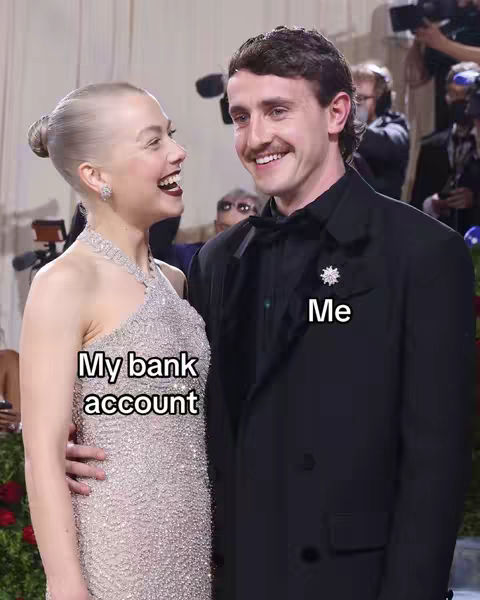 A photo from what appears to be a red-carpet event, featuring a man and a woman, both smiling at each other. The woman is wearing a silver, sequined dress and has her hair up. The man is in a black suit with a bow tie. Text overlays label them "My bank account" and "Me".