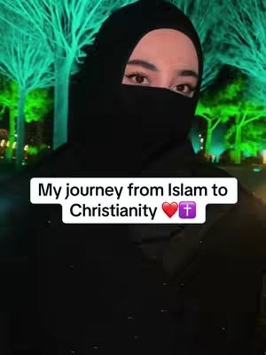 A woman wearing a black hijab and niqab is the focus, looking directly at the camera. A text overlay reads the video's premise. The background is blurred, showing green-lit trees.