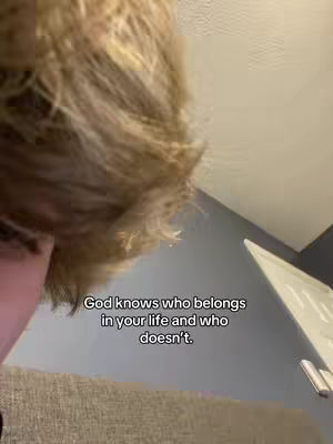 The image shows a close-up of a person's head and shoulder, with blonde hair partially obscuring the face. The person is positioned near the top left, and the text overlay is centered at the bottom of the image.