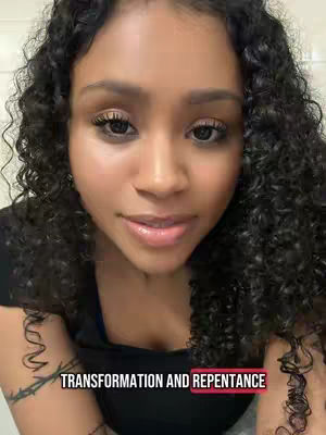 A close-up shot of a woman with curly black hair looking down at the camera, smiling slightly. Text appears in a red box at the bottom, reading 'TRANSFORMATION AND REPENTANCE.' She has clear skin and natural makeup.