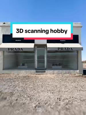 The image features a stark, modern building with a Prada storefront, set against a clear blue sky. The building appears to be a single-story structure with a flat roof and a central entrance. The facade is primarily white, with black accents, and the Prada logo is prominently displayed above the storefront. A text overlay in a contrasting color is placed over the building.