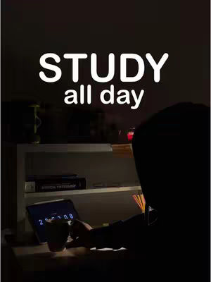 A backlit image shows a person, likely a student, sitting at a desk with a tablet displaying a clock. The desk is cluttered with a mug, with other study materials on a nearby table. A large, white text overlay dominates the top, while the background is dark, illuminated only by a small light.