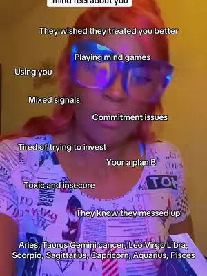 A selfie-style image featuring a person with reddish-orange hair and large blue-tinted glasses. The person is facing the camera, and there are several text overlays in the image offering insights into someone's feelings. The overall composition is focused, likely used for a personal commentary or tarot reading.