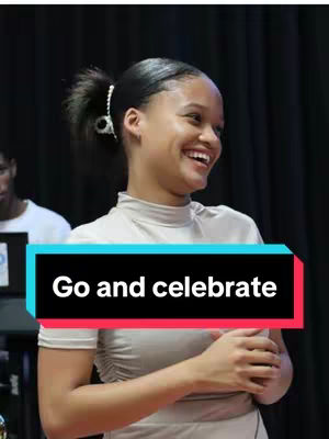 A woman with dark hair in a high ponytail smiles widely in front of a dark background. The bottom of the image holds a teal rectangle with the words Go and celebrate.