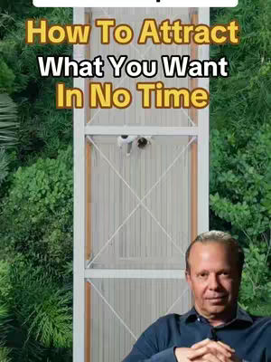 The cover image shows a man in a dark blue shirt with his arms crossed. Behind him is a tall, white structure that appears to be a high-rise building or installation, with green foliage on either side. The video title is overlaid over the top.