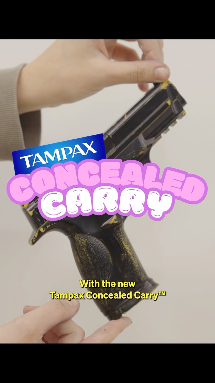 The image shows a pair of hands holding a replica gun. Overlaid are text elements and logos. The background appears to be a solid, light color.