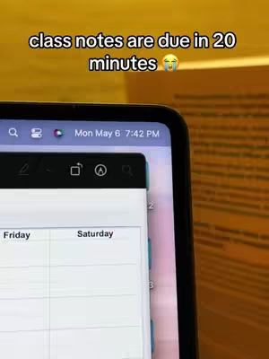 The image shows a close-up of a tablet or phone screen displaying a digital calendar app. The time at the top reads 'Mon, May 6 7:42 PM'. The screen is black, with a white calendar interface, showing 'Friday' and 'Saturday' in the calendar. The text overlay is at the top, with the text 'class notes are due in 20 minutes' with a crying emoji.