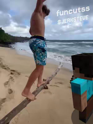 A person is standing on a log at the beach, with the ocean in the background and a Minecraft character in the foreground.