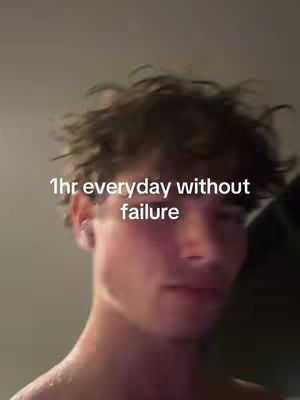 A selfie-style shot featuring a young man from the chest up. He has short, tousled brown hair and is looking slightly off-center towards the left. Overlayed on the image is white text.