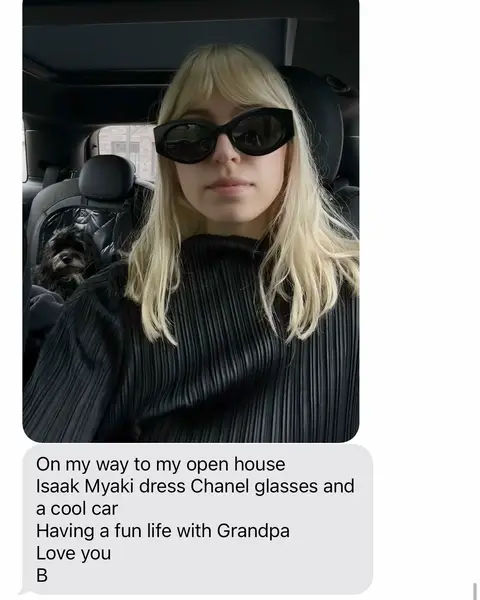 A young woman wearing sunglasses sits in the driver's seat of a car. The image is a selfie. A small dog is visible in the backseat. Overlayed at the bottom is a text messages with details about the scene.