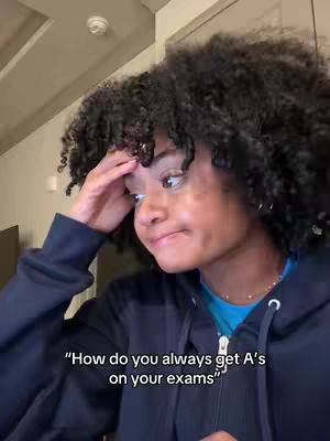 A young woman with curly hair is shown from the chest up, with one hand on her forehead and a thoughtful expression. The background is blurred. Text overlays the image with a question.