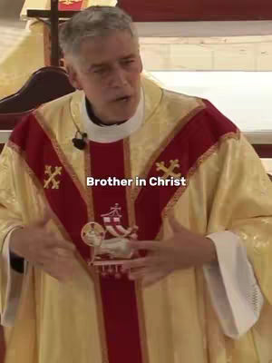 The cover image shows a man, presumably a religious figure judging by his attire, speaking in front of what appears to be a church interior. The man is the central focus, dressed in a cream and red vestment with detailed religious iconography.