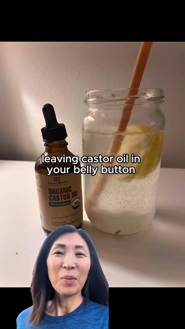 A woman's face is in the lower-left. To the right, is a clear glass jar with a yellow lemon, topped with a clear liquid and a straw. Next to the jar is a bottle of organic castor oil. The hook text is overlaid on the image.