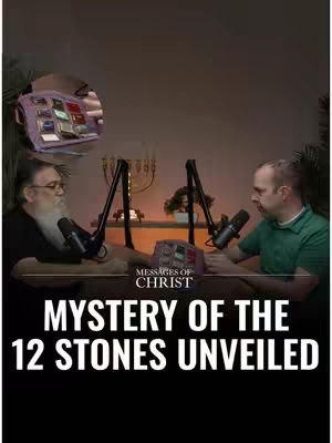 Two men are seated at a table, each with a microphone. They are likely in a studio, as evidenced by the background details which include a lighting setup and a small plant. The main focal point features the text: 'MYSTERY OF THE 12 STONES UNVEILED'. Above the men's heads, a smaller inset displays an image of a breastplate.