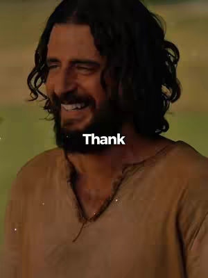 The cover image displays a smiling man with long dark hair and a beard, possibly depicting Jesus, against a blurred background. The man is wearing a garment with a V-neck. Text overlayed is white and says "Thank".