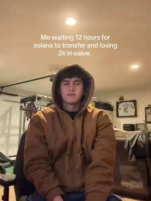A young man in a brown hoodie is centered in the frame, sitting in front of a dark background. Text overlay is present, and equipment, possibly related to a home gym, is subtly visible in the background.