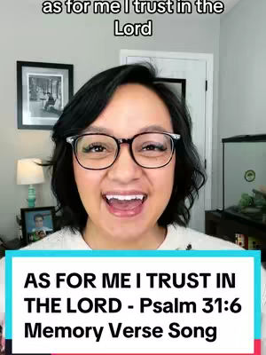 A woman with glasses smiles widely at the camera in a well-lit indoor setting. Text overlays feature a Bible verse and a title.